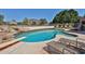 Inviting pool area with lounge chairs, a diving board, and scenic mountain views at 22521 N 60Th Ave, Glendale, AZ 85310