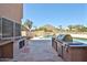 Lush backyard with built-in grill area, a swimming pool and scenic desert views at 22521 N 60Th Ave, Glendale, AZ 85310