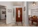 Welcoming entryway with decorative glass front door, tile flooring, and adjacent dining area at 2348 W Comstock Dr, Chandler, AZ 85224