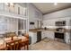 Bright kitchen with white cabinets, granite countertops, stainless steel appliances, and a sunny breakfast nook at 2348 W Comstock Dr, Chandler, AZ 85224