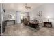 Bright living room with tile flooring, fireplace, and sliding door to the patio at 2348 W Comstock Dr, Chandler, AZ 85224