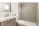 Bathroom features a modern vanity, neutral tile shower, and contemporary fixtures at 2356 W Catalina Ave, Mesa, AZ 85202