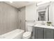 Bathroom boasts neutral tile, modern fixtures, and a combined shower and bathtub at 2356 W Catalina Ave, Mesa, AZ 85202