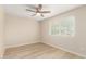 Bedroom features a modern ceiling fan, and abundant natural light from window at 2356 W Catalina Ave, Mesa, AZ 85202