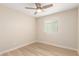 This bedroom offers a ceiling fan, and abundant natural light from window at 2356 W Catalina Ave, Mesa, AZ 85202
