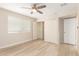 This bedroom features a spacious closet, ceiling fan and ample light from the window at 2356 W Catalina Ave, Mesa, AZ 85202