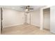 This bedroom features a closet, ceiling fan, and light wood flooring at 2356 W Catalina Ave, Mesa, AZ 85202