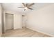Comfortable bedroom with closet, fan, and light wood flooring at 2356 W Catalina Ave, Mesa, AZ 85202