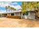 Well-maintained house with green shrubbery, desert landscaping, and neutral paint at 2356 W Catalina Ave, Mesa, AZ 85202