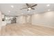 Open-concept living area with an adjacent white kitchen at 2356 W Catalina Ave, Mesa, AZ 85202
