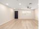 An open-concept living area with new light-colored flooring and a ceiling fan at 2356 W Catalina Ave, Mesa, AZ 85202