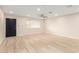 The living area boasts new light-colored flooring, recessed lighting, and a ceiling fan at 2356 W Catalina Ave, Mesa, AZ 85202