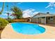 Backyard pool featuring custom shape and concrete patio with established trees at 2356 W Catalina Ave, Mesa, AZ 85202
