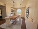 Dining room with modern light fixture, wood table, and stylish decor at 2904 W Belmont Ave, Phoenix, AZ 85051