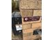 Emergency gate opening with a warning sign on a brick wall, ensuring safety and accessibility at 2904 W Belmont Ave, Phoenix, AZ 85051
