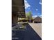 Exterior with a covered area next to a brick building, showcasing functional and connected spaces at 2904 W Belmont Ave, Phoenix, AZ 85051