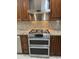 Kitchen features stainless steel appliances, granite counters, and custom cabinets for a luxurious feel at 2904 W Belmont Ave, Phoenix, AZ 85051