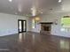 Open living area featuring a brick fireplace and abundant natural light at 2904 W Belmont Ave, Phoenix, AZ 85051