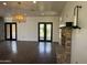 Spacious living room with hardwood floors, fireplace, and contemporary light fixture at 2904 W Belmont Ave, Phoenix, AZ 85051