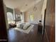 Serene main bedroom with vaulted ceiling, arched windows, and neutral color scheme at 2904 W Belmont Ave, Phoenix, AZ 85051