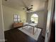 Home office featuring modern desk, stylish decor, and a ceiling fan, offering a comfortable workspace at 2904 W Belmont Ave, Phoenix, AZ 85051