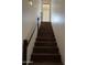 Staircase with wooden steps, leading to the next level of the home at 2904 W Belmont Ave, Phoenix, AZ 85051