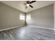 Bright and airy bedroom with wood-look vinyl flooring and a ceiling fan at 2945 N 19Th Ave # 78, Phoenix, AZ 85015