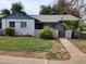 Charming single-story home with a well-maintained front yard, palm tree, and a quaint fence at 2945 N 19Th Ave # 78, Phoenix, AZ 85015