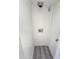 Bright laundry area features modern gray wood floors and white walls with water hookups at 2945 N 19Th Ave # 78, Phoenix, AZ 85015