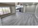 Bright living room featuring gray floors, large window, and open view to the updated kitchen at 2945 N 19Th Ave # 78, Phoenix, AZ 85015