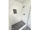 Shower featuring white herringbone tiling, a black tiled floor, and a modern shower head at 2945 N 19Th Ave # 78, Phoenix, AZ 85015