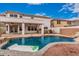 Sparkling pool with a relaxing inflatable, surrounded by beautiful landscaping and a spacious patio at 3135 W Molly Ln, Phoenix, AZ 85083