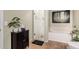 Bright bathroom featuring walk-in shower, a soaking tub, and stylish decor at 3135 W Molly Ln, Phoenix, AZ 85083