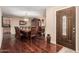 Elegant dining room with hardwood floors, a grand dining table, and a display cabinet at 3135 W Molly Ln, Phoenix, AZ 85083
