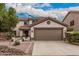 Charming two-story home featuring a large two-car garage and a well-maintained front yard at 3135 W Molly Ln, Phoenix, AZ 85083