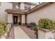 Inviting entryway with a secure front door, bench seating, and manicured plants at 3135 W Molly Ln, Phoenix, AZ 85083