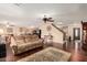 Spacious open concept living area featuring hardwood floors, ceiling fan and comfortable sofa at 3135 W Molly Ln, Phoenix, AZ 85083