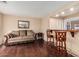 Spacious living room with hardwood floors, bar seating, and a comfortable sofa at 3135 W Molly Ln, Phoenix, AZ 85083