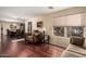 Comfortable living room showcasing hardwood floors, plush seating, and natural light through the window at 3135 W Molly Ln, Phoenix, AZ 85083