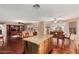 Open concept living area with kitchen, dining area and living room creating a flowing space for entertaining at 3135 W Molly Ln, Phoenix, AZ 85083