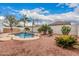 Resort style pool, lush landscaping, and rock accents create a backyard oasis at 3135 W Molly Ln, Phoenix, AZ 85083