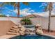 Picturesque pool with a waterfall feature, surrounded by lush greenery and a privacy wall at 3135 W Molly Ln, Phoenix, AZ 85083