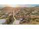 Expansive aerial view of a community with desert landscaping, mountain views, and neighborhood streets at 3201 N 91St St, Mesa, AZ 85207