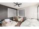 Bedroom featuring a ceiling fan, vinyl floors, and lots of natural lighting at 3201 N 91St St, Mesa, AZ 85207