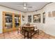Cozy dining area boasting beautiful tile flooring, ample natural light, and a round table with bench seating at 3201 N 91St St, Mesa, AZ 85207