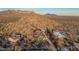 Custom home with mountain views featuring a red roof, private driveway, and desert landscaping at 3201 N 91St St, Mesa, AZ 85207