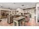 Charming kitchen featuring custom cabinets, concrete countertops, a center island, and stainless steel appliances at 3201 N 91St St, Mesa, AZ 85207
