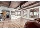 Inviting living room with wooden ceilings, large windows, and tile flooring at 3201 N 91St St, Mesa, AZ 85207