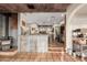 Inviting living room featuring tile floors, a wood burning stove, and an open concept design to the kitchen at 3201 N 91St St, Mesa, AZ 85207