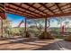 Covered patio with desert views, flag, and shade at 3201 N 91St St, Mesa, AZ 85207